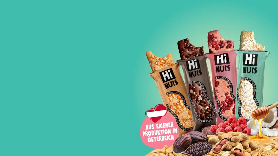 Vier HiNUtS Nussriegel mit Erdnüssen, Himbeeren und Kokos